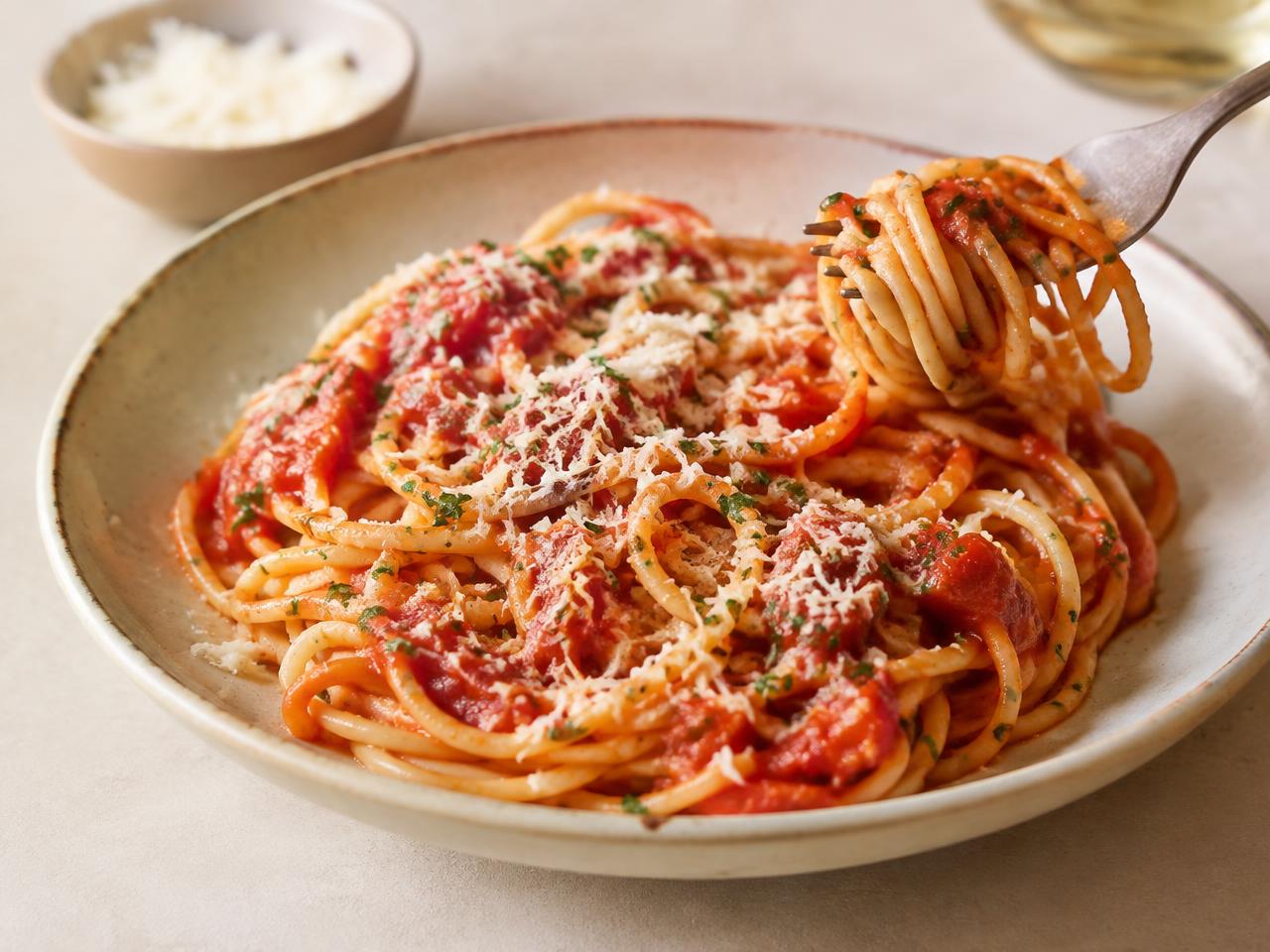 Hearty plate of pasta with tomato sauce and parmesan